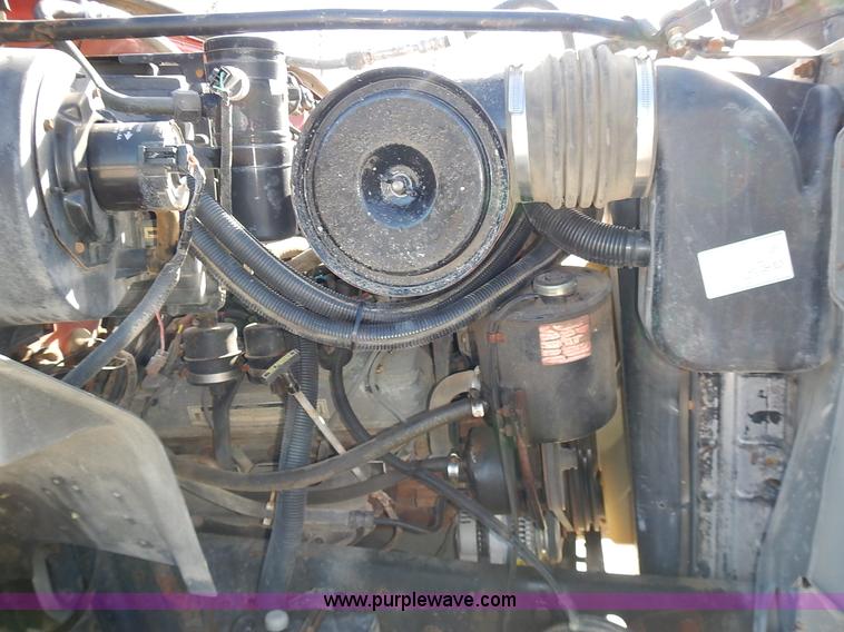 image for item J6343 1995 Ford F750 dump truck with scissor lift bed