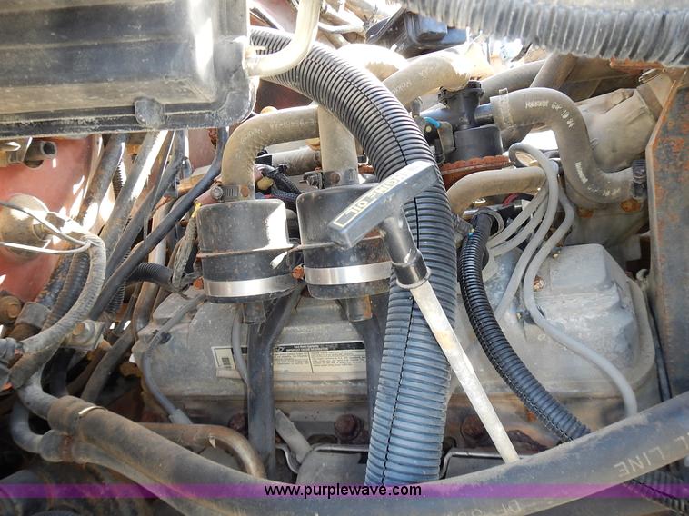 image for item J6343 1995 Ford F750 dump truck with scissor lift bed