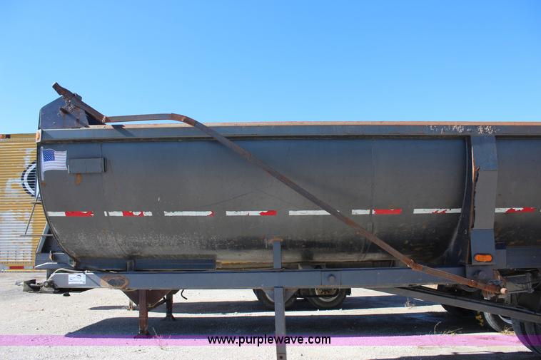 image for item J7736 1999 Travis HRS end dump trailer