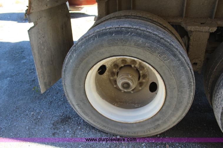 image for item J7736 1999 Travis HRS end dump trailer