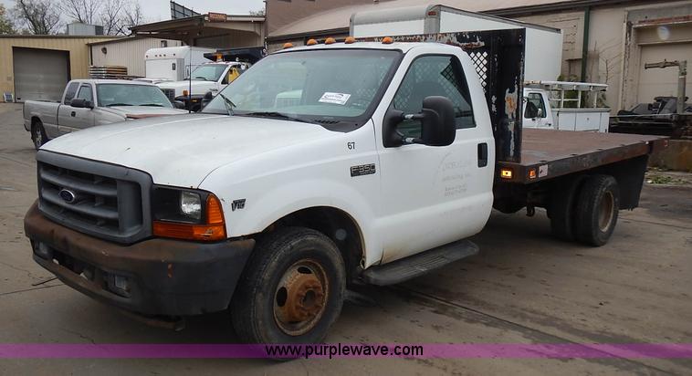 image for item L3573 1999 Ford F350 Super Duty XL flatbed pickup truck