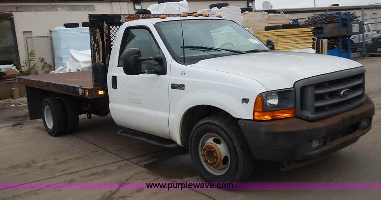 image for item L3573 1999 Ford F350 Super Duty XL flatbed pickup truck