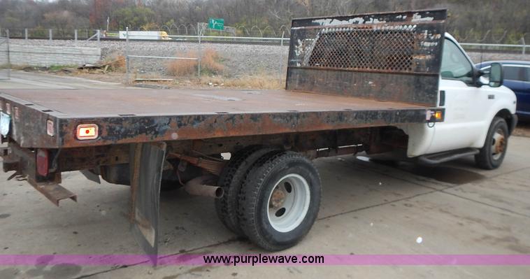 image for item L3573 1999 Ford F350 Super Duty XL flatbed pickup truck