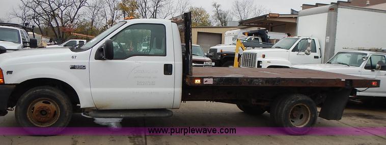 image for item L3573 1999 Ford F350 Super Duty XL flatbed pickup truck