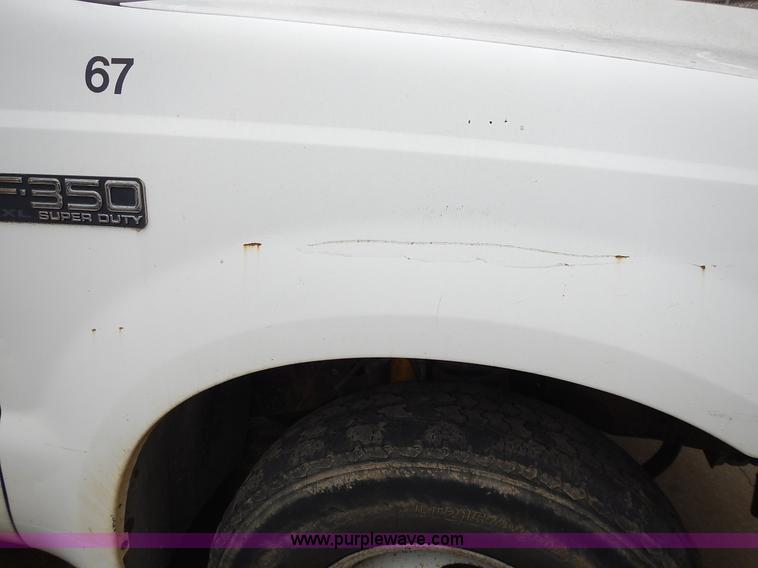 image for item L3573 1999 Ford F350 Super Duty XL flatbed pickup truck