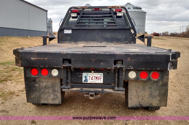 image for item L6038 2004 Ford F350 Super Duty Lariat King Ranch Crew Cab flatbed pickup truck