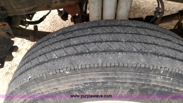 image for item L6038 2004 Ford F350 Super Duty Lariat King Ranch Crew Cab flatbed pickup truck