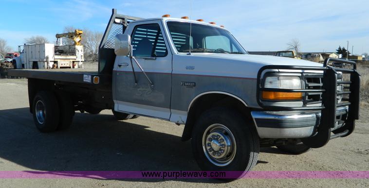 image for item J5151 1994 Ford F450 Super Duty flatbed dump truck