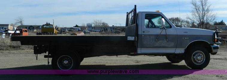 image for item J5151 1994 Ford F450 Super Duty flatbed dump truck