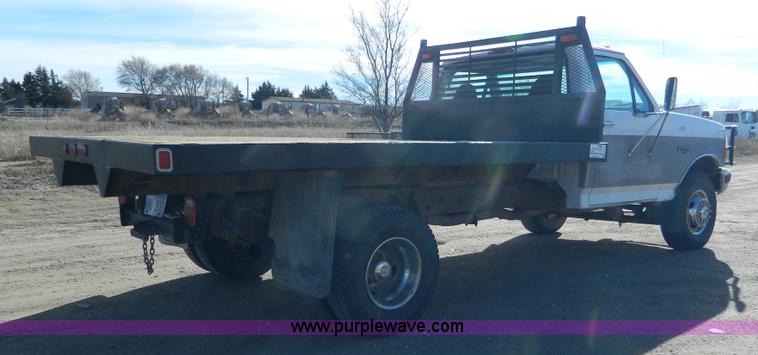 image for item J5151 1994 Ford F450 Super Duty flatbed dump truck