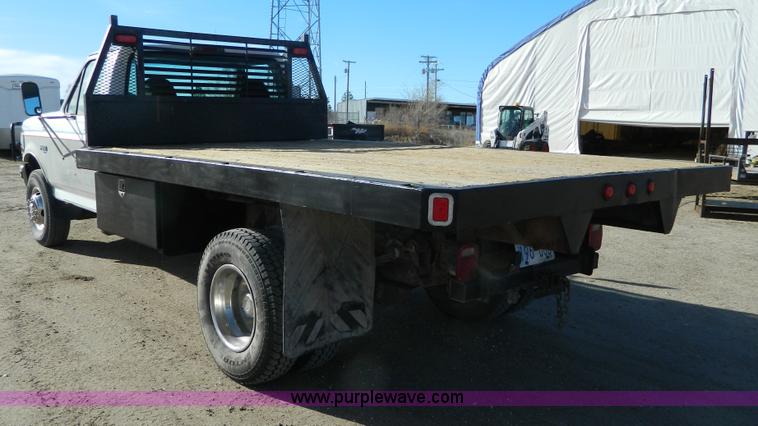image for item J5151 1994 Ford F450 Super Duty flatbed dump truck