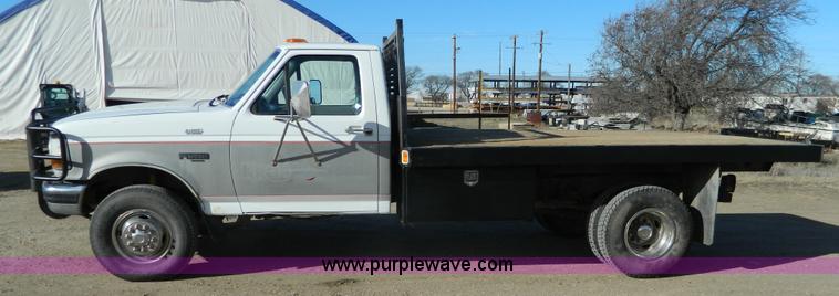 image for item J5151 1994 Ford F450 Super Duty flatbed dump truck