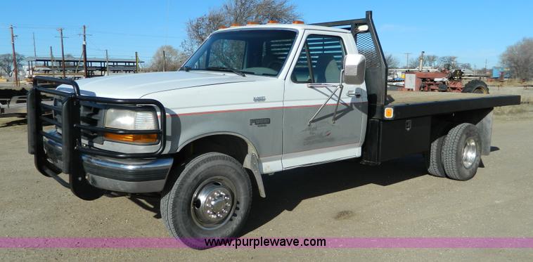 image for item J5151 1994 Ford F450 Super Duty flatbed dump truck