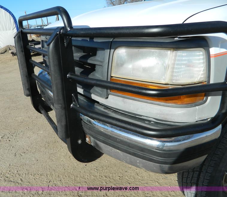 image for item J5151 1994 Ford F450 Super Duty flatbed dump truck
