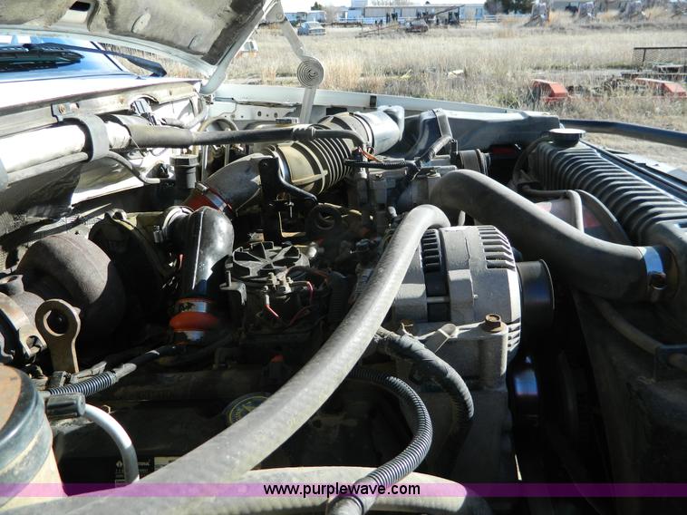 image for item J5151 1994 Ford F450 Super Duty flatbed dump truck