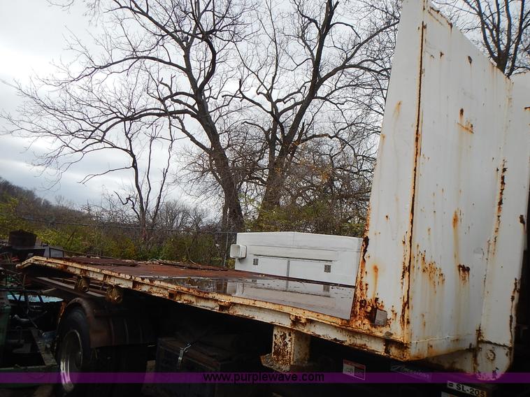 image for item J6341 1997 Freightliner FL70 rollback truck