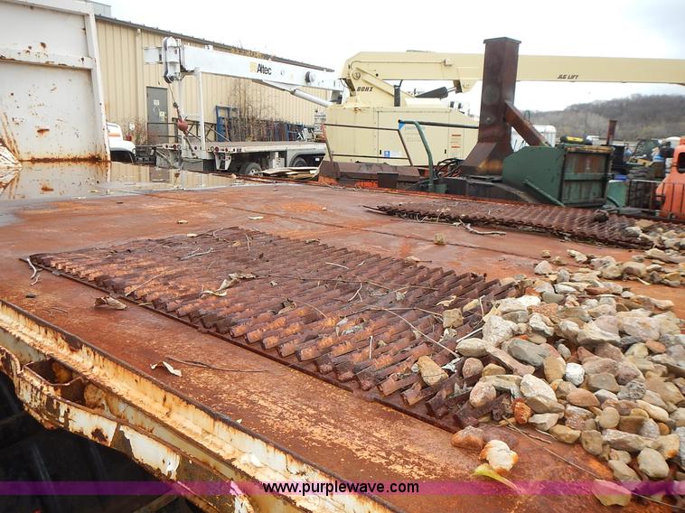 image for item J6341 1997 Freightliner FL70 rollback truck