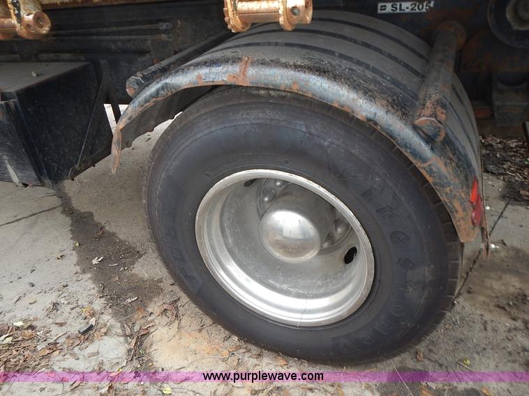 image for item J6341 1997 Freightliner FL70 rollback truck