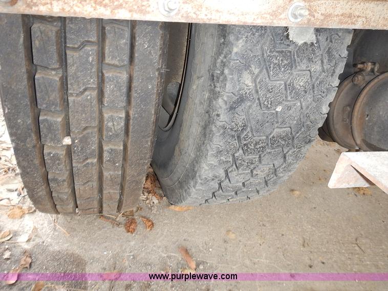 image for item J6341 1997 Freightliner FL70 rollback truck