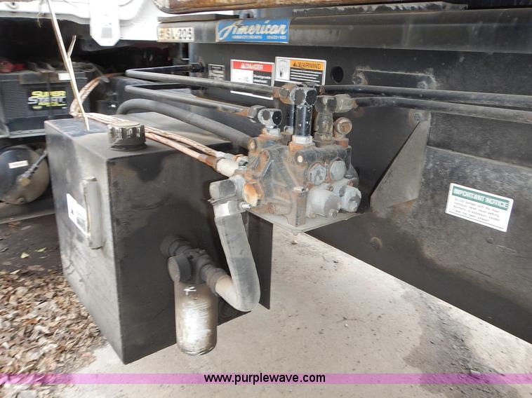 image for item J6341 1997 Freightliner FL70 rollback truck