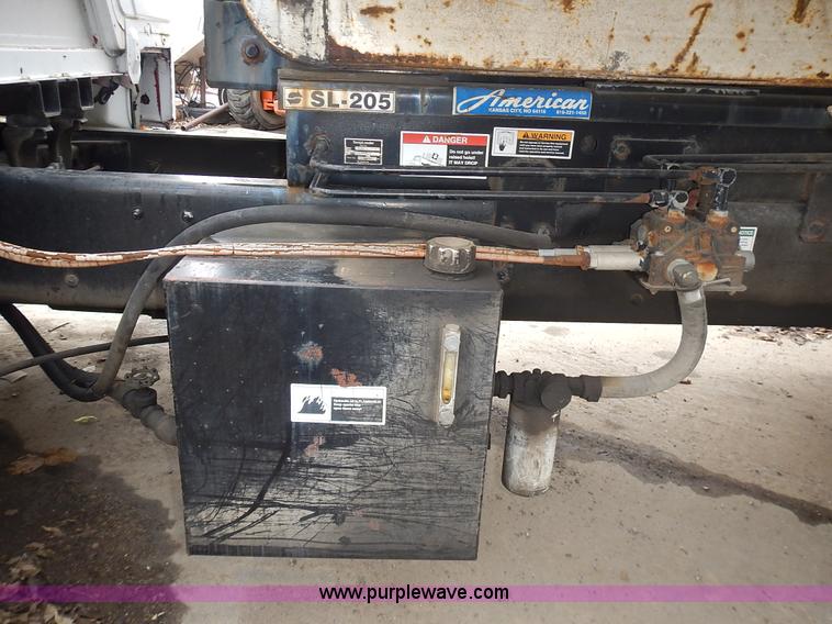 image for item J6341 1997 Freightliner FL70 rollback truck