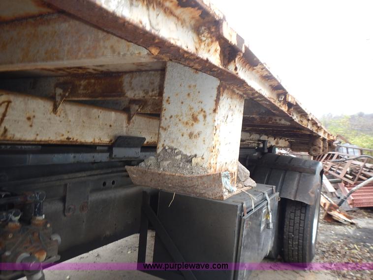 image for item J6341 1997 Freightliner FL70 rollback truck