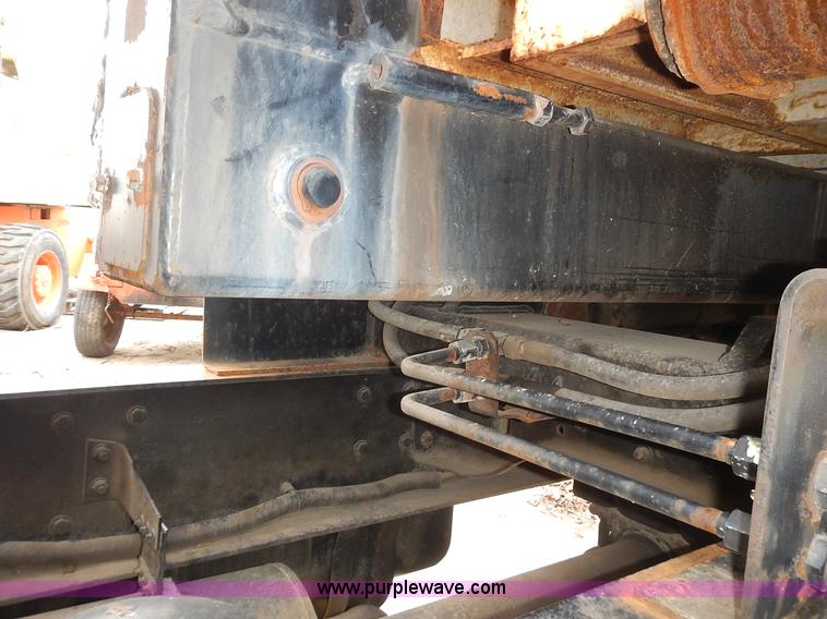 image for item J6341 1997 Freightliner FL70 rollback truck