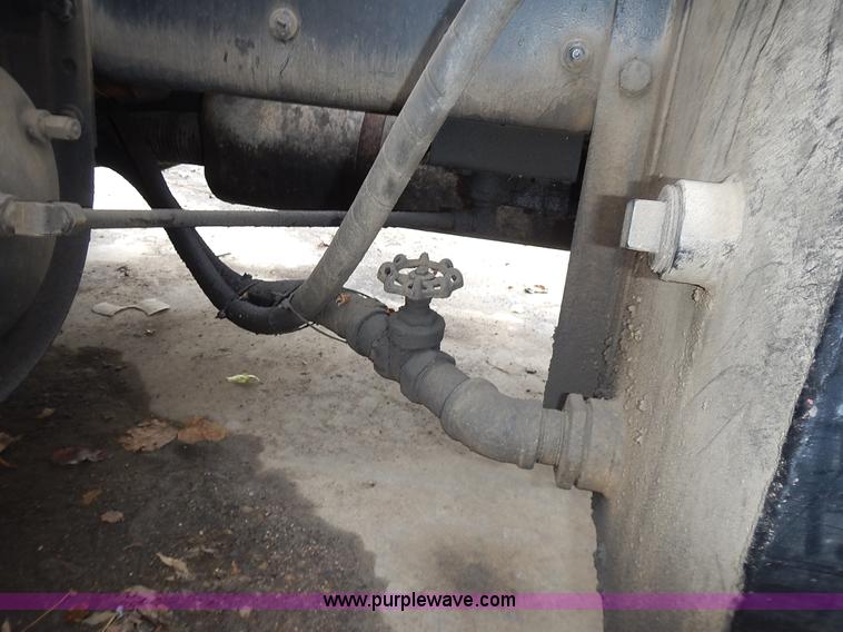 image for item J6341 1997 Freightliner FL70 rollback truck