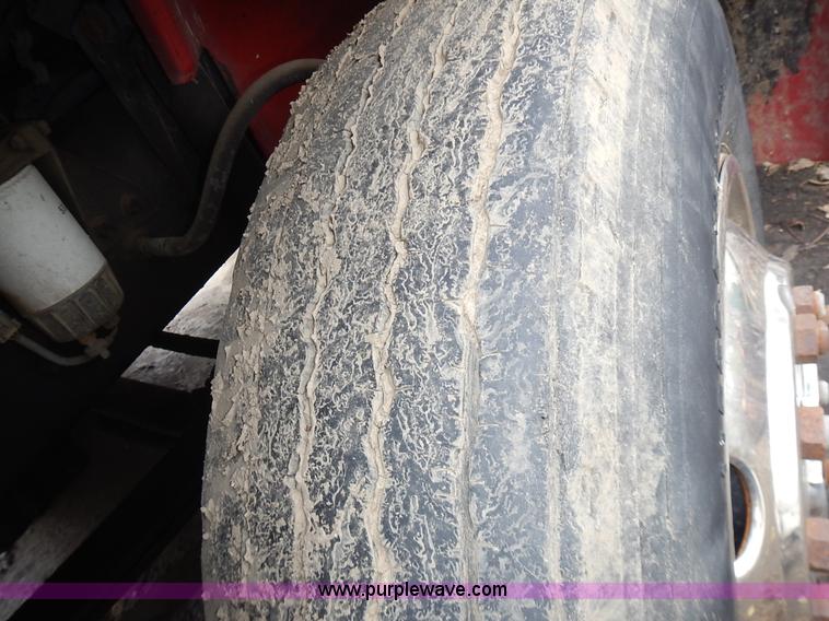 image for item J6341 1997 Freightliner FL70 rollback truck