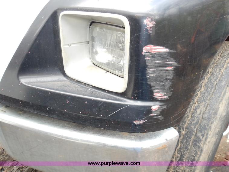 image for item J6341 1997 Freightliner FL70 rollback truck