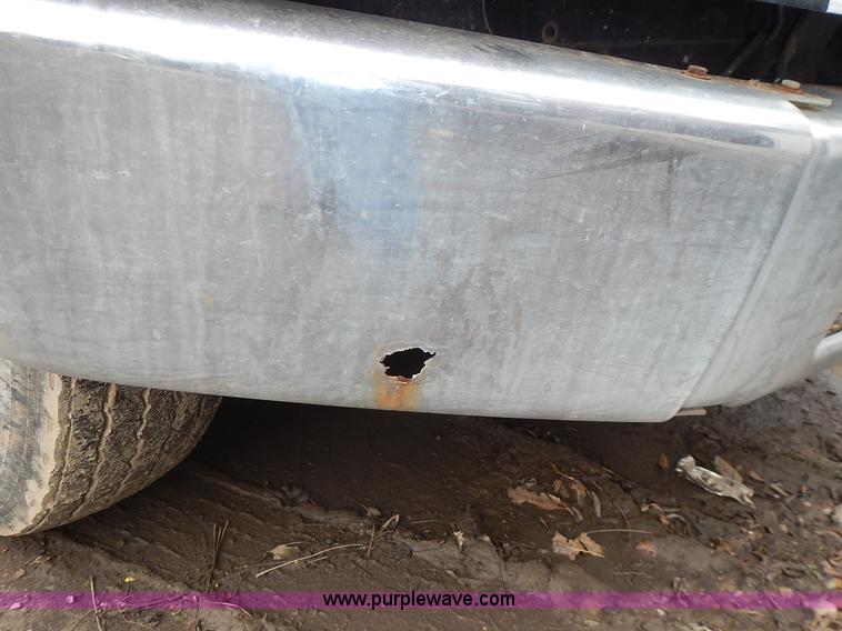 image for item J6341 1997 Freightliner FL70 rollback truck