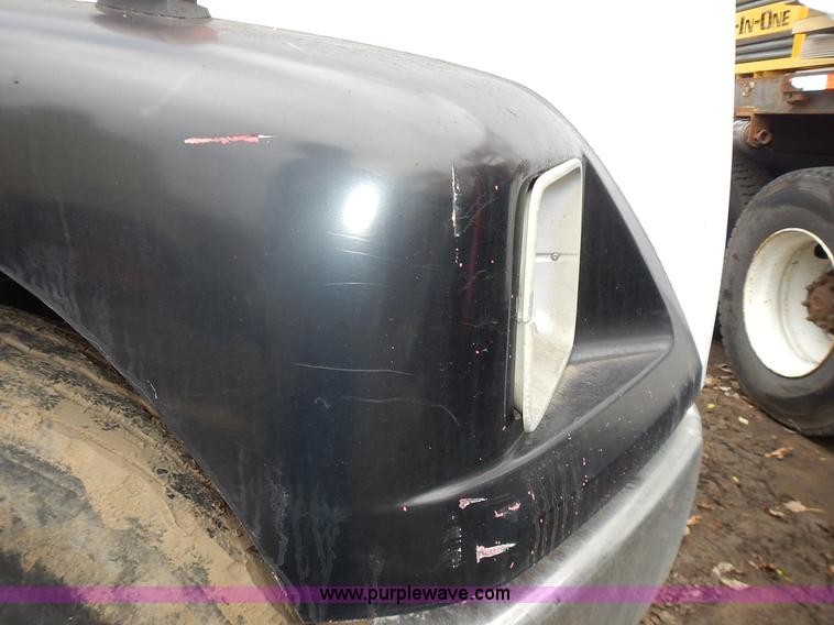 image for item J6341 1997 Freightliner FL70 rollback truck