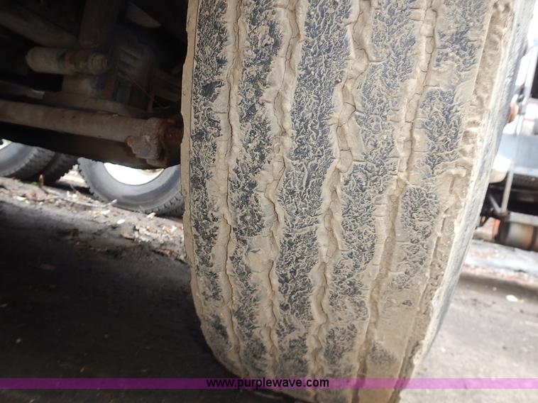 image for item J6341 1997 Freightliner FL70 rollback truck