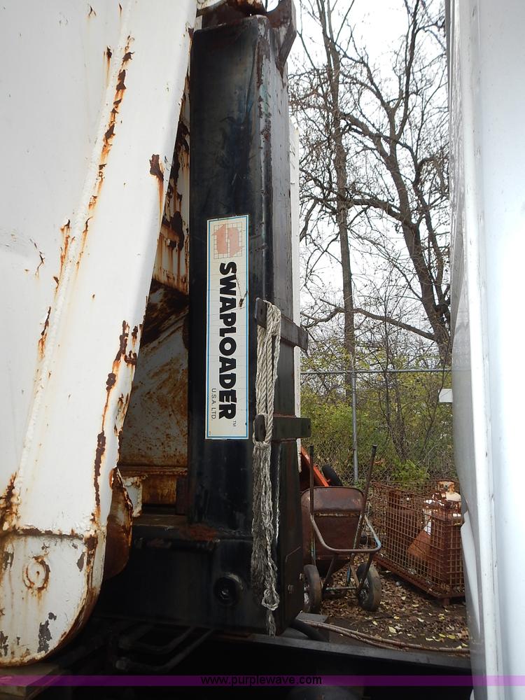 image for item J6341 1997 Freightliner FL70 rollback truck