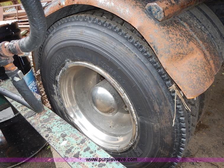 image for item J6341 1997 Freightliner FL70 rollback truck