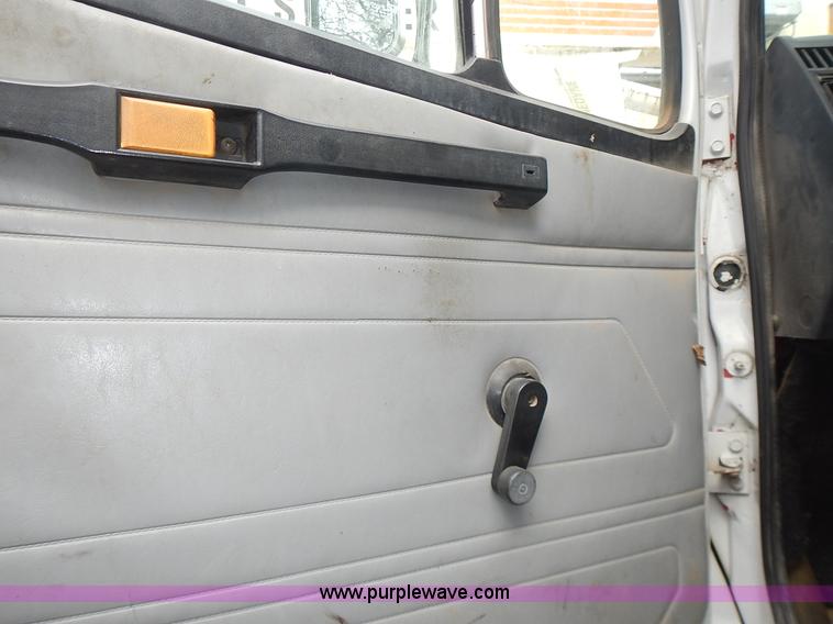 image for item J6341 1997 Freightliner FL70 rollback truck