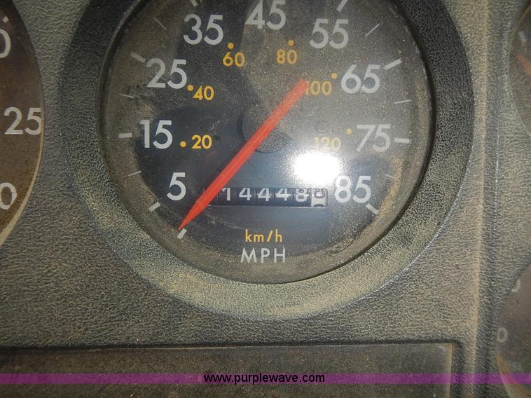 image for item J6341 1997 Freightliner FL70 rollback truck