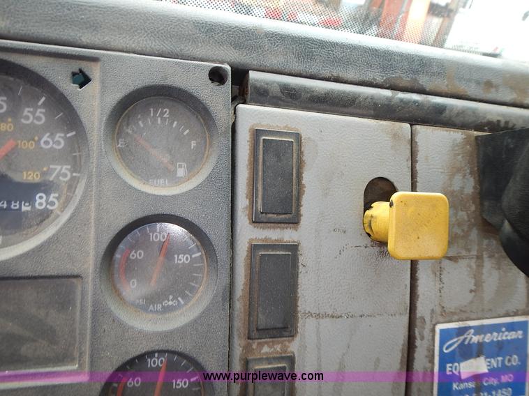 image for item J6341 1997 Freightliner FL70 rollback truck