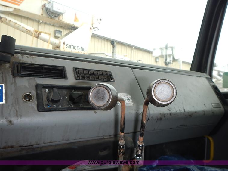 image for item J6341 1997 Freightliner FL70 rollback truck