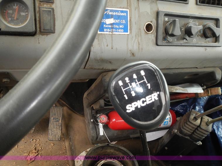 image for item J6341 1997 Freightliner FL70 rollback truck