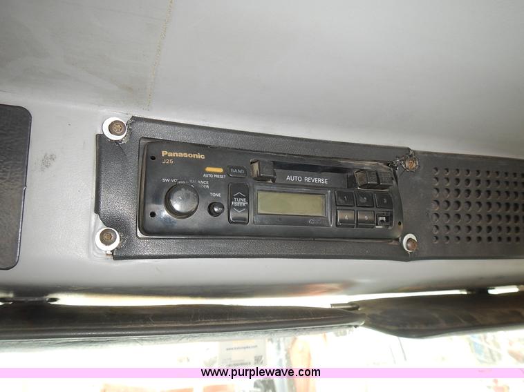 image for item J6341 1997 Freightliner FL70 rollback truck