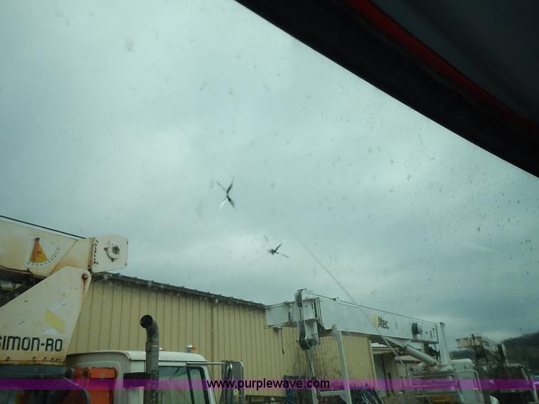 image for item J6341 1997 Freightliner FL70 rollback truck