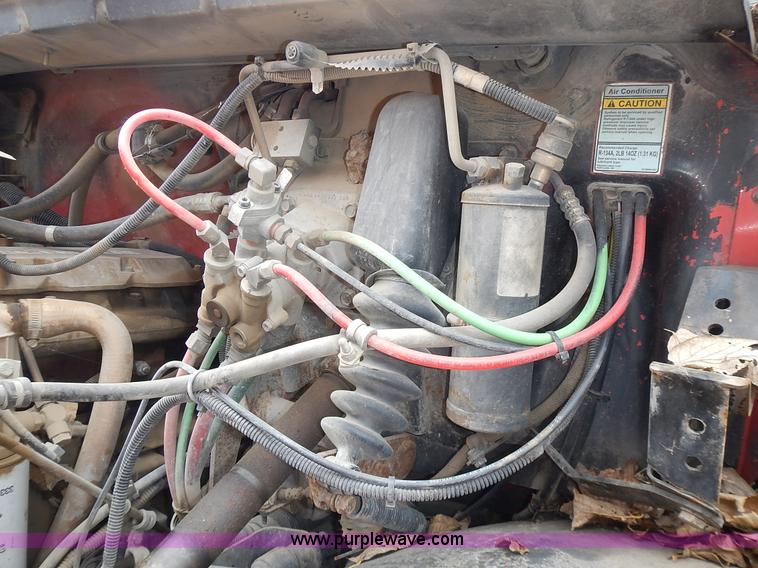 image for item J6341 1997 Freightliner FL70 rollback truck