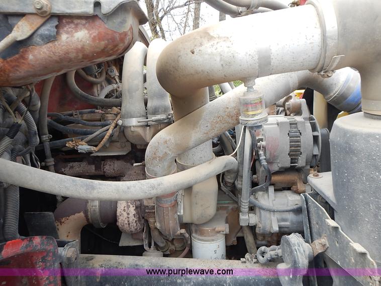 image for item J6341 1997 Freightliner FL70 rollback truck