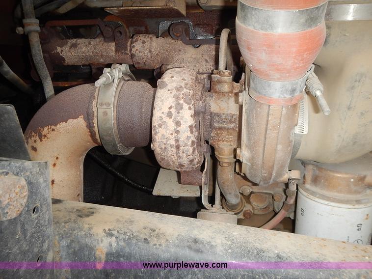 image for item J6341 1997 Freightliner FL70 rollback truck