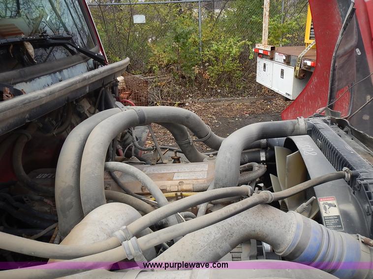 image for item J6341 1997 Freightliner FL70 rollback truck