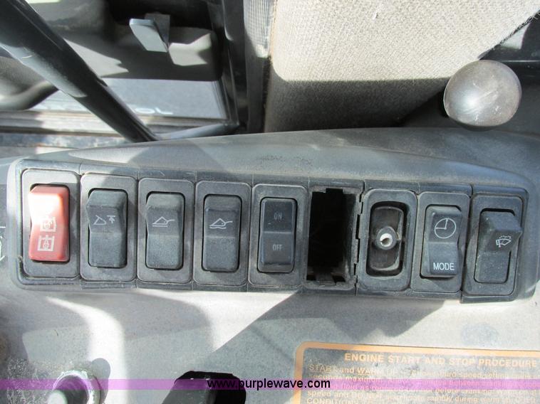 image for item K5211 2004 John Deere 304H wheel loader