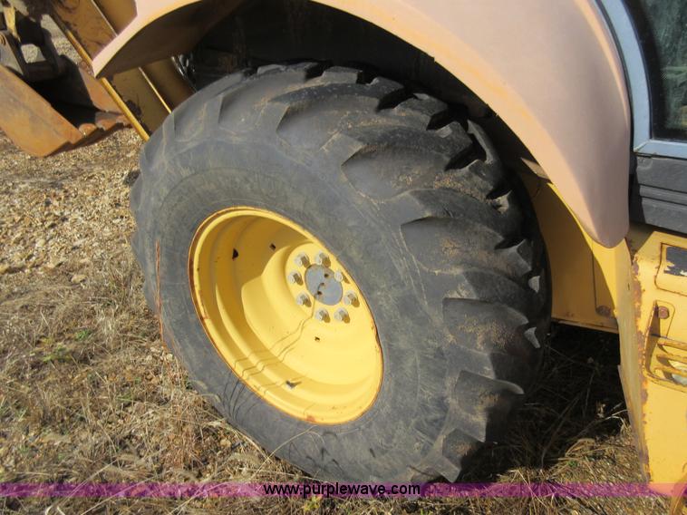 image for item K5253 1999 New Holland 675E backhoe