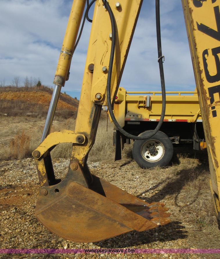 image for item K5253 1999 New Holland 675E backhoe