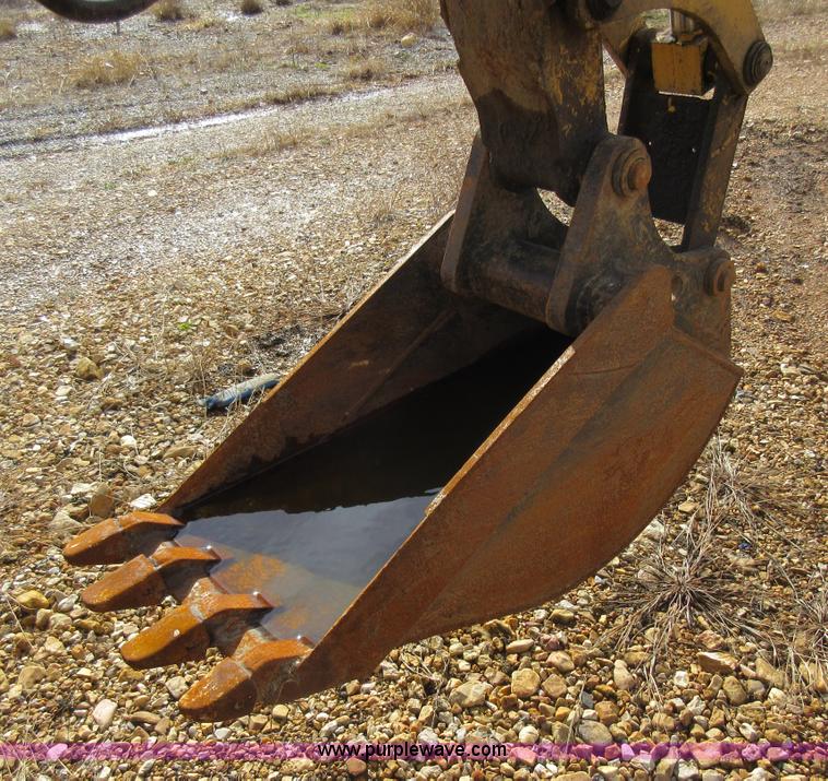 image for item K5253 1999 New Holland 675E backhoe